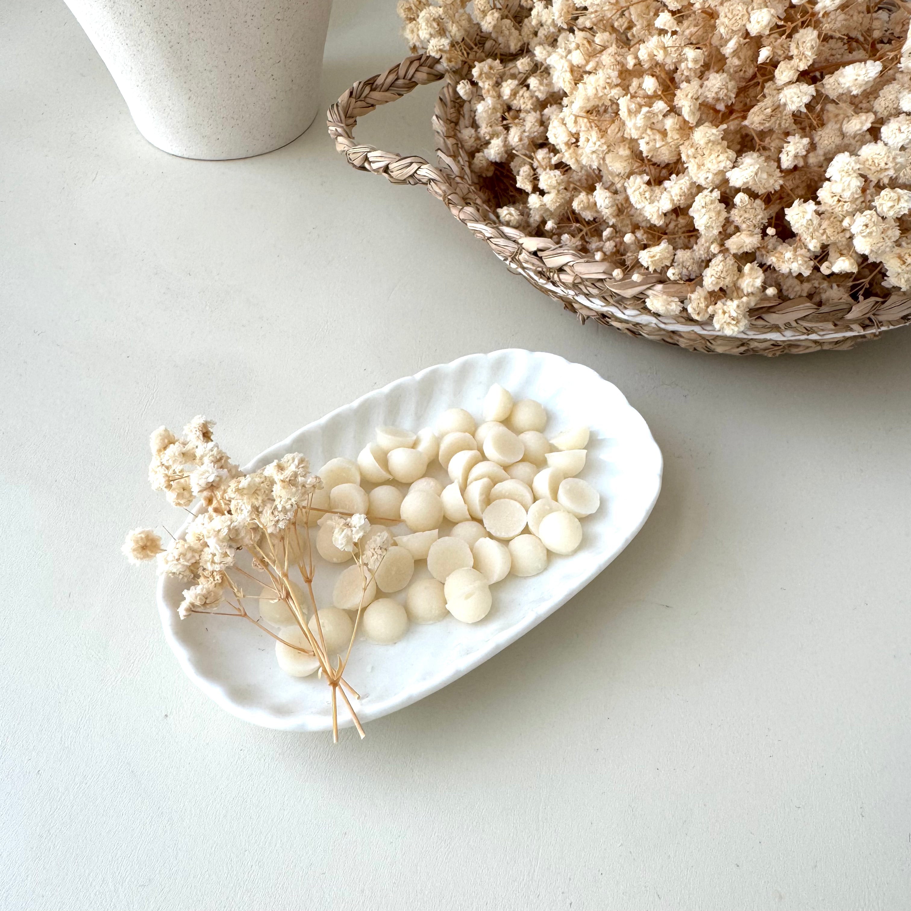 Travel Mini soaps beads, soap on the go on white dish