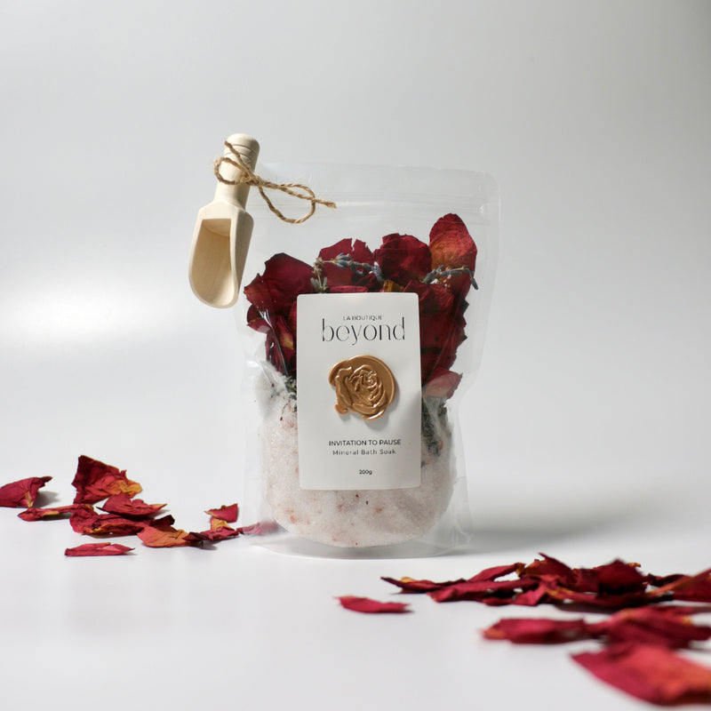 Bath soaks with dried lavender and rose petals and Epsom salt with Himalayan pink salt in pouch with wooden pouch