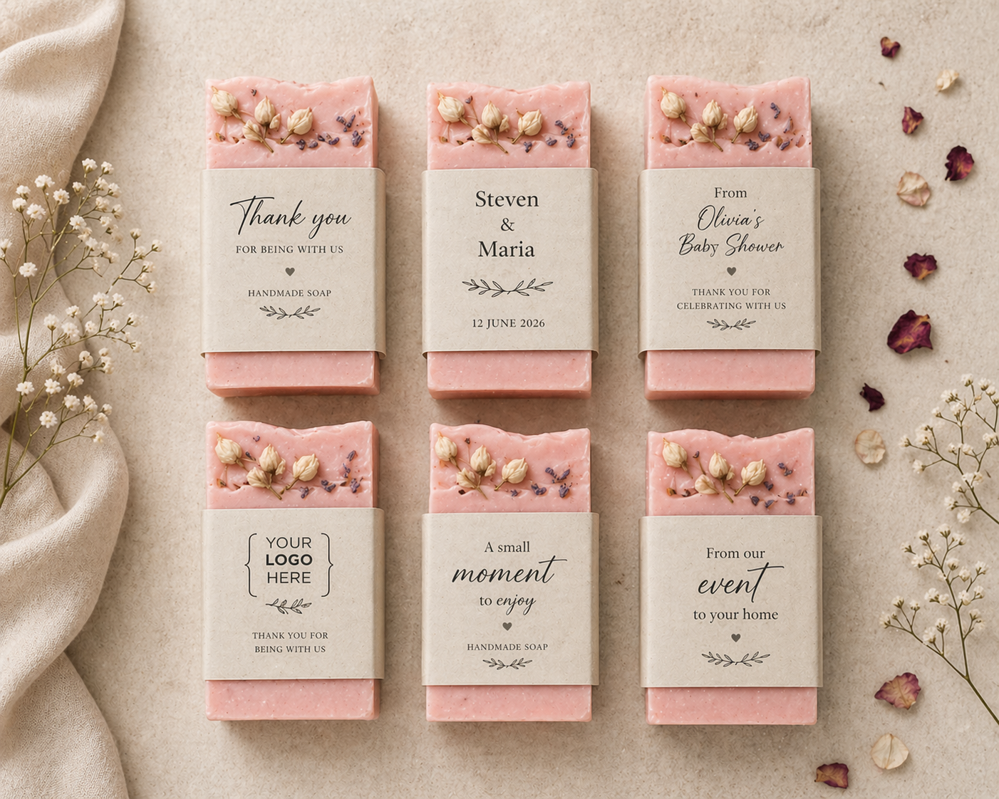Set of pink soap bars with personalized labels on a beige background