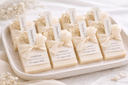 Set of soap bars with personalized labels on a white tray