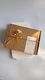 Gift set soap box and a packaging labeled 'La Boutique Beyond' on a brown box on a white background 