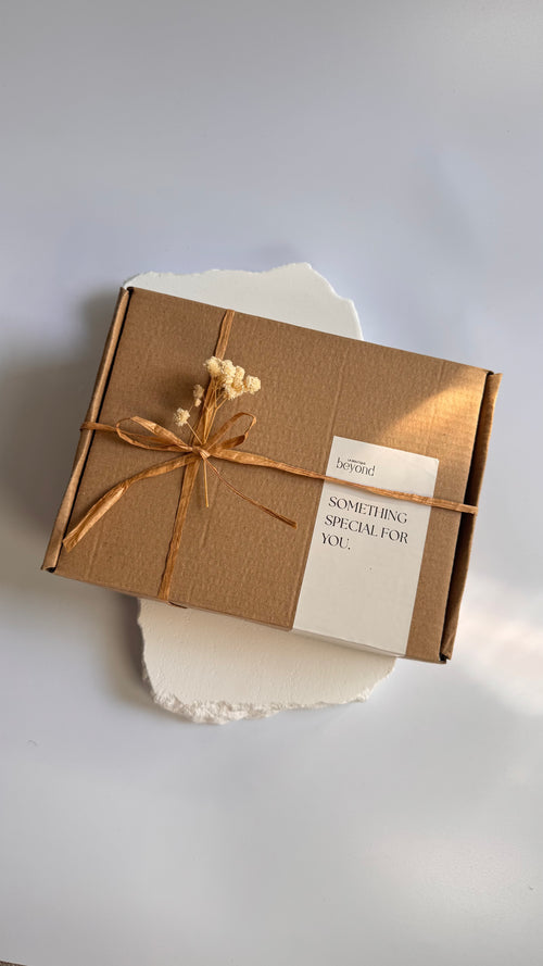 Gift set soap box and a packaging labeled 'La Boutique Beyond' on a brown box on a white background 