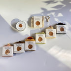 Row of soap bars  with soap pouch and mini travel soaps to choose from for the gift set box of 'La Boutique Beyond' coffee packages on a light gray background