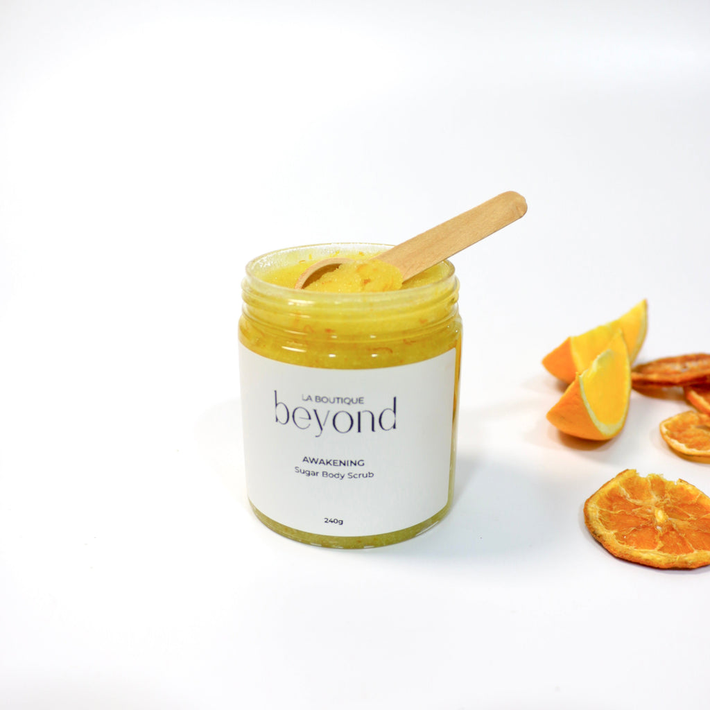 Jar of orange zest sugar body scrub on a white background