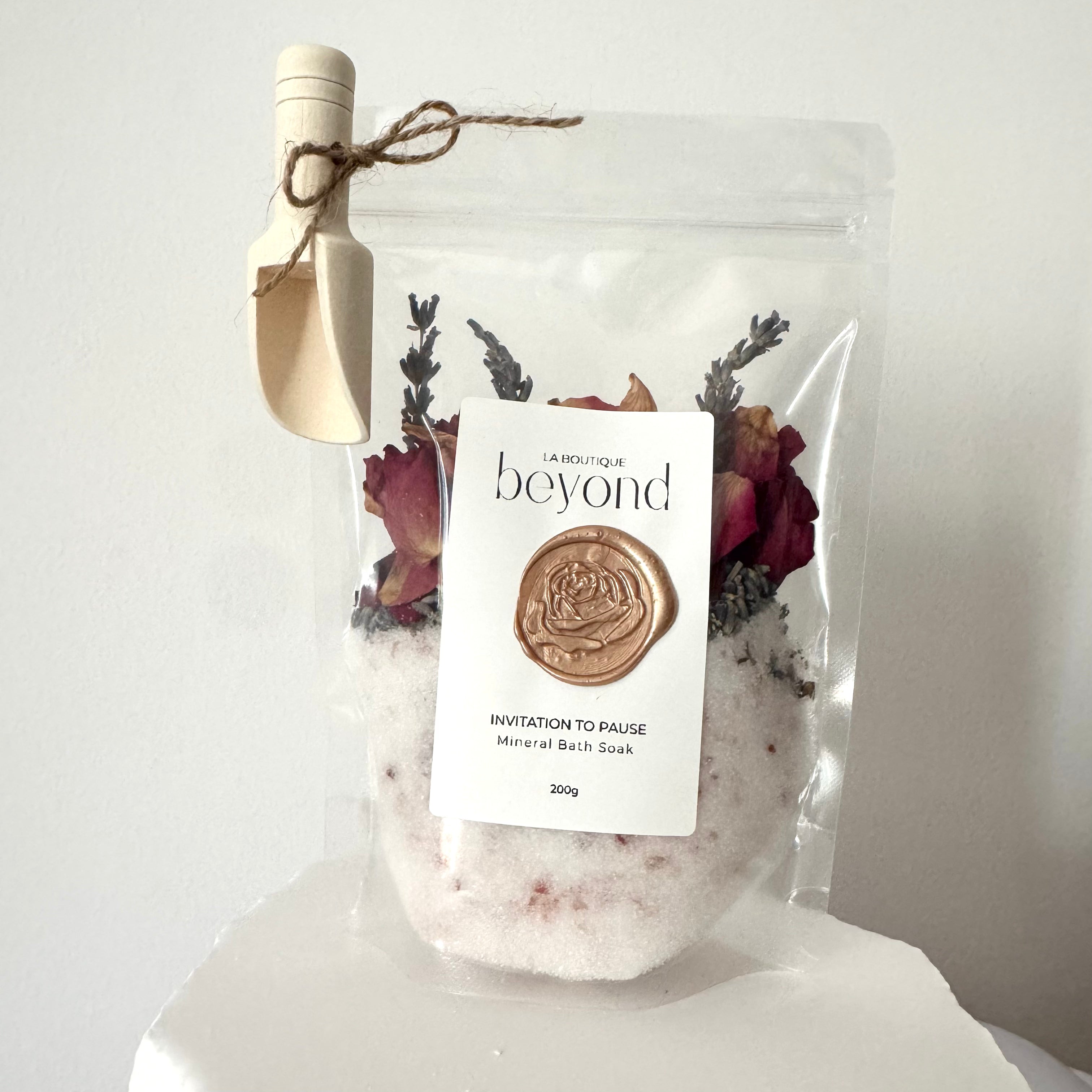 Invitation to Pause bath soak pouch with dried roses and lavender flowers 
