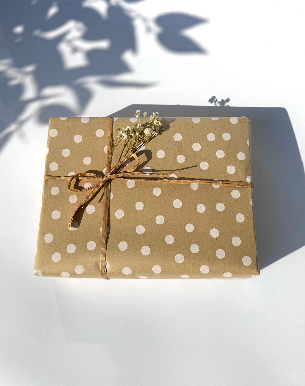 Beautifully wrapped soap gift box in kraft paper with twine and dried flowers